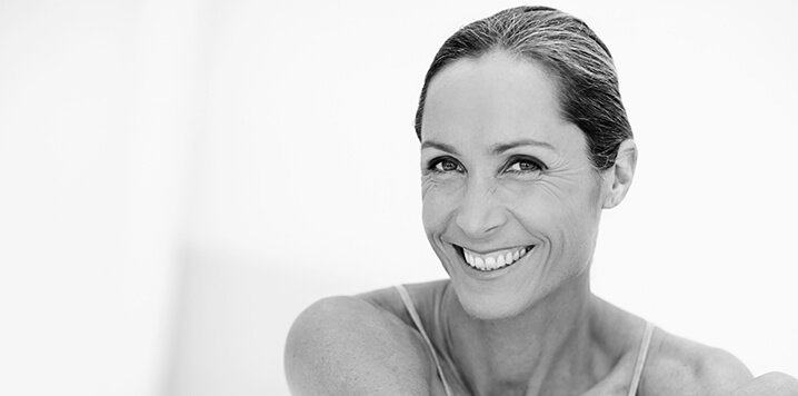A woman with rejuvenated skin smiling