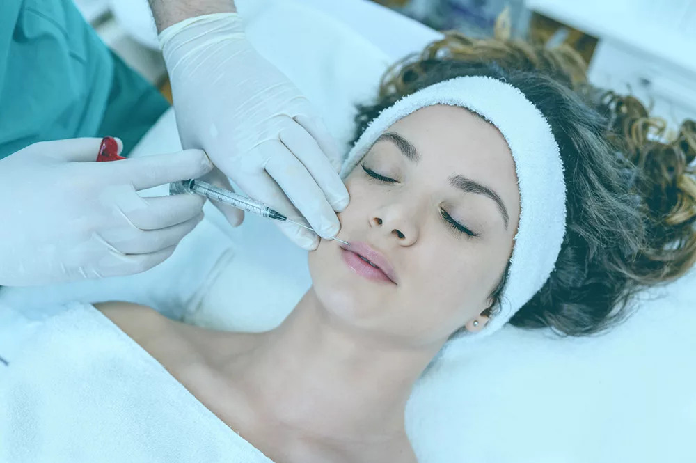 A woman at her first dermal filler appointment