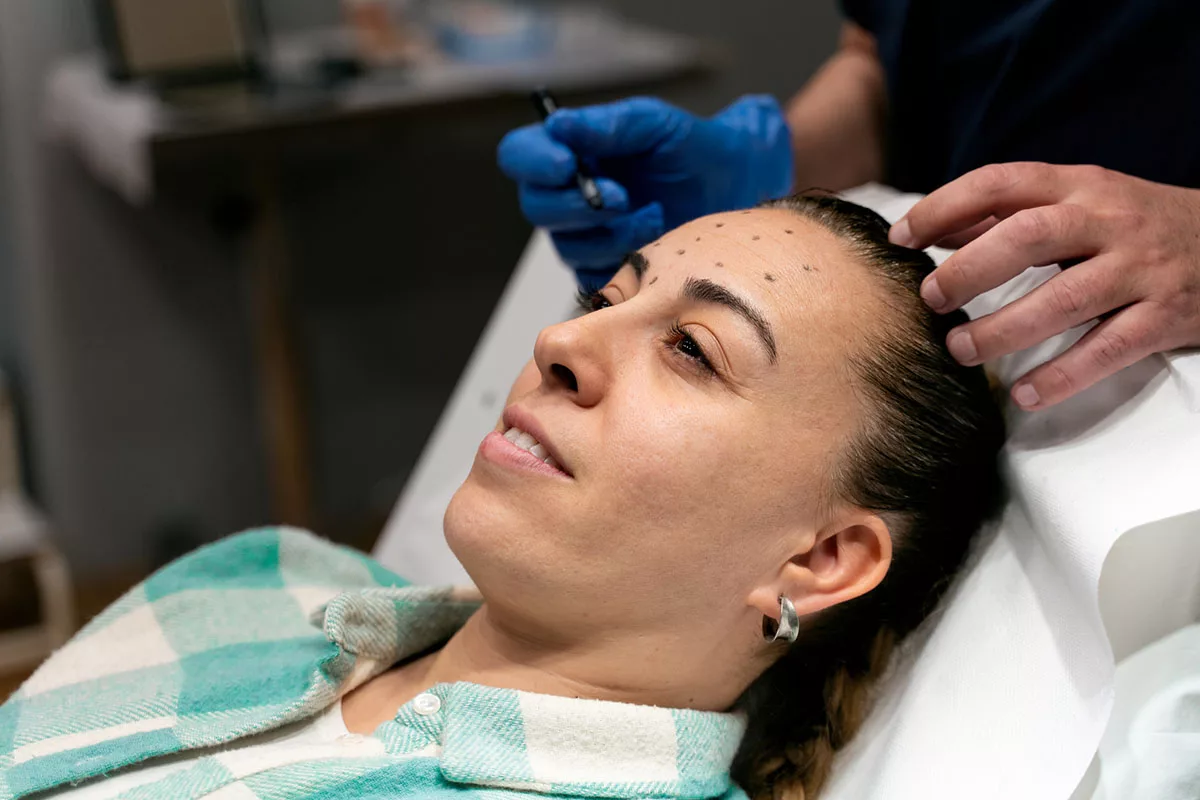 a woman receiving botox or dysport injections