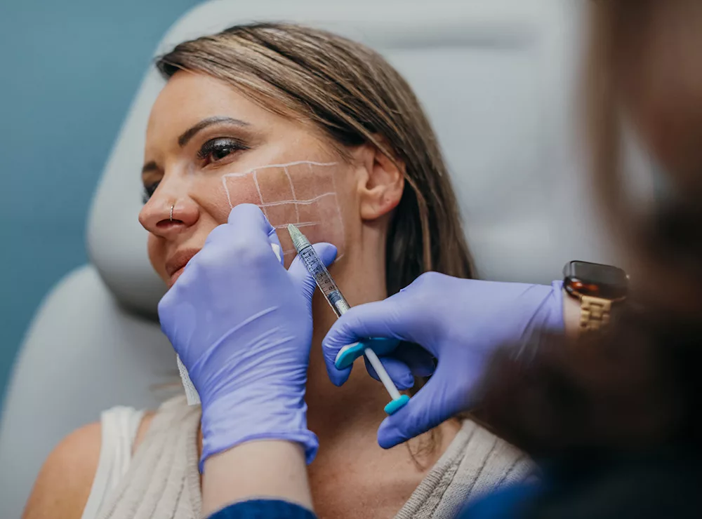 A patient getting SKINVIVE injection at DermaBlue