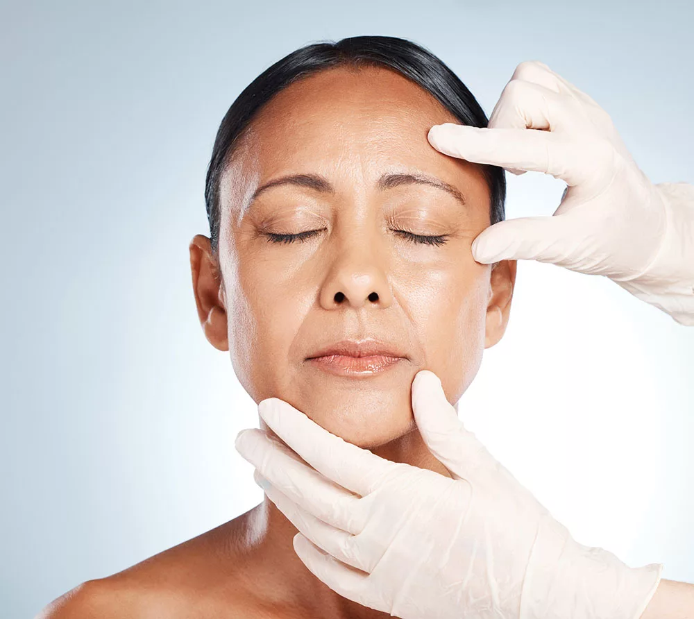 a woman undergoes a skin assessment to determine if botox or dysport are right for her
