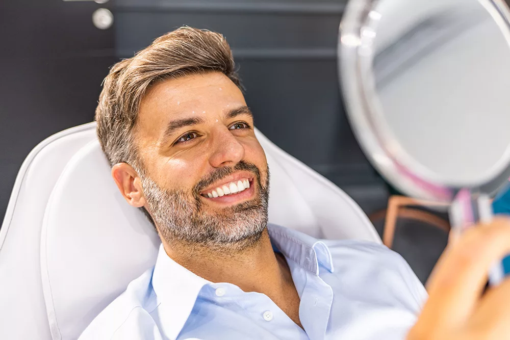a man smiles either before or after botox appointment