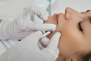a woman receiving cosmetic injectables