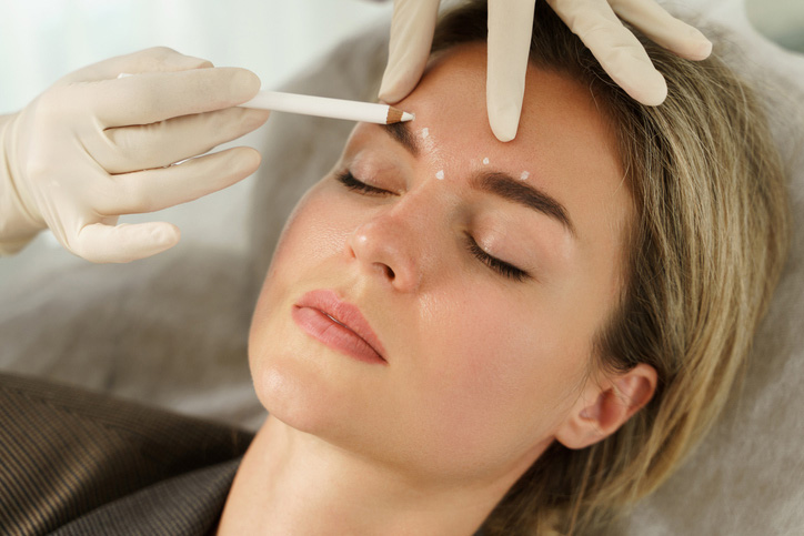 a patient and injector during a consultation for botox in hendersonville, nc